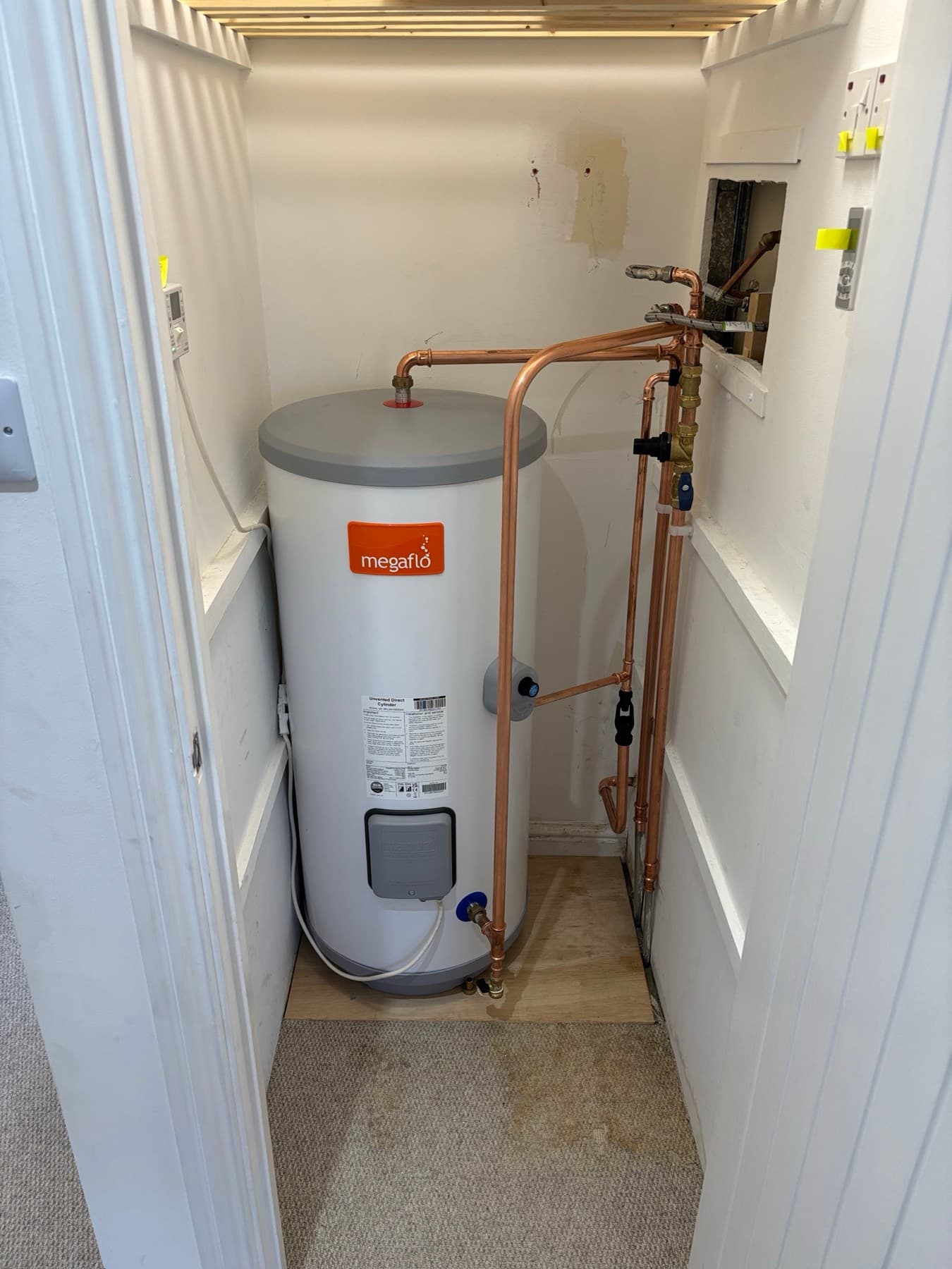 A professionally installed Megaflo unvented cylinder with neat pipework