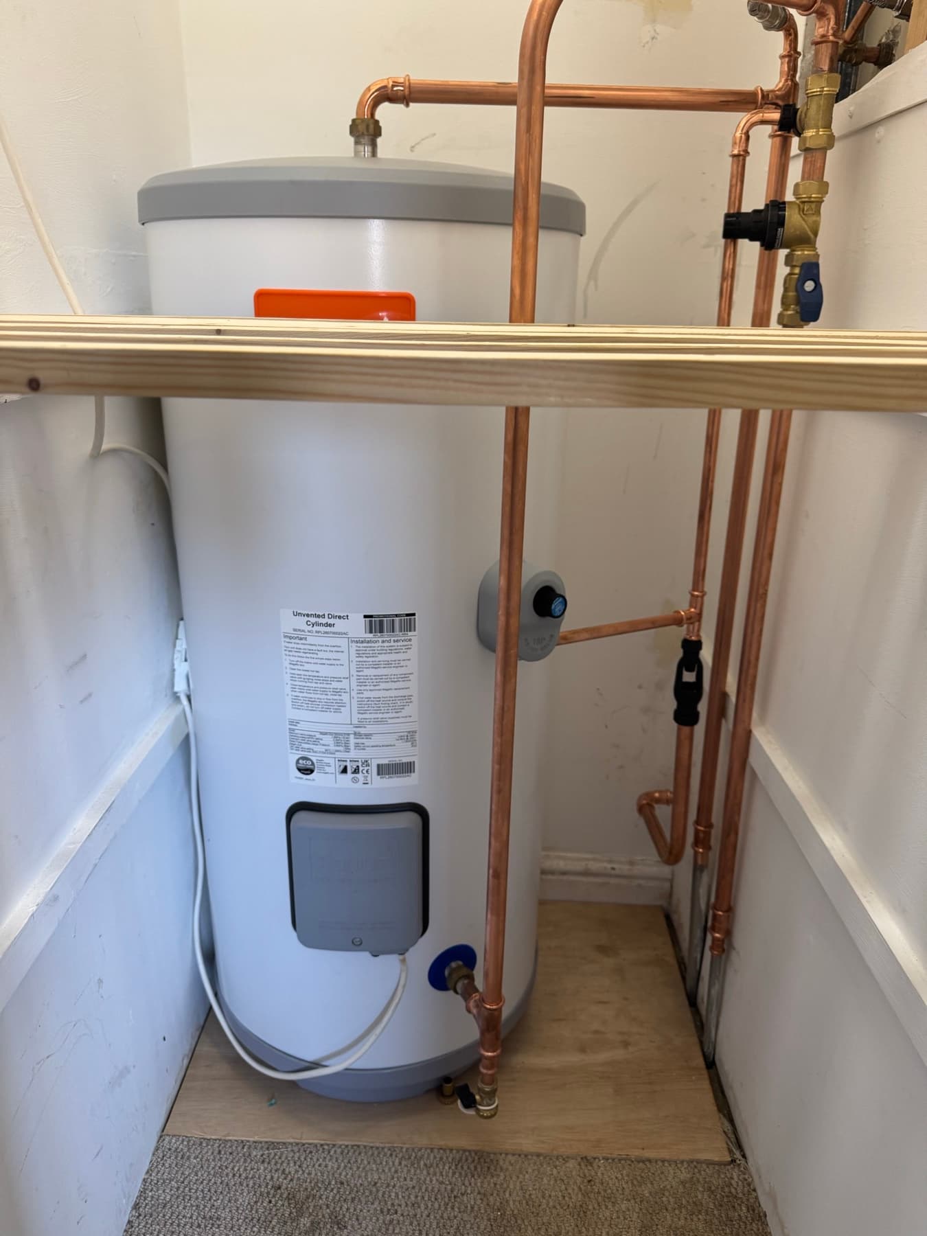 Unvented hot water cylinder in an airing cupboard with new copper pipework, fitted by Rosebourne Plumbing