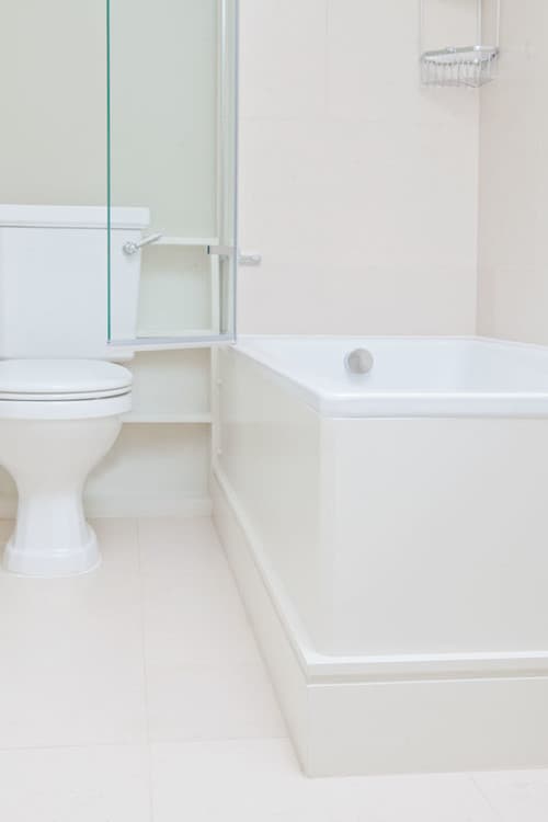 Bath, Screen and WC in a Compact Bathroom - Professional plumbing work by Rosebourne Plumbing