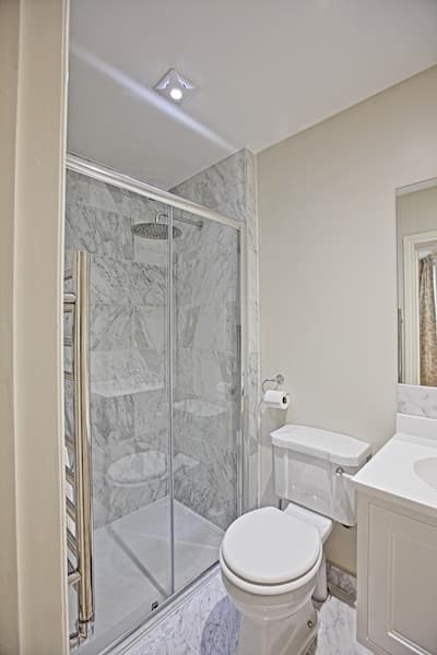Marble-Tiled Shower Room - Professional plumbing work by Rosebourne Plumbing