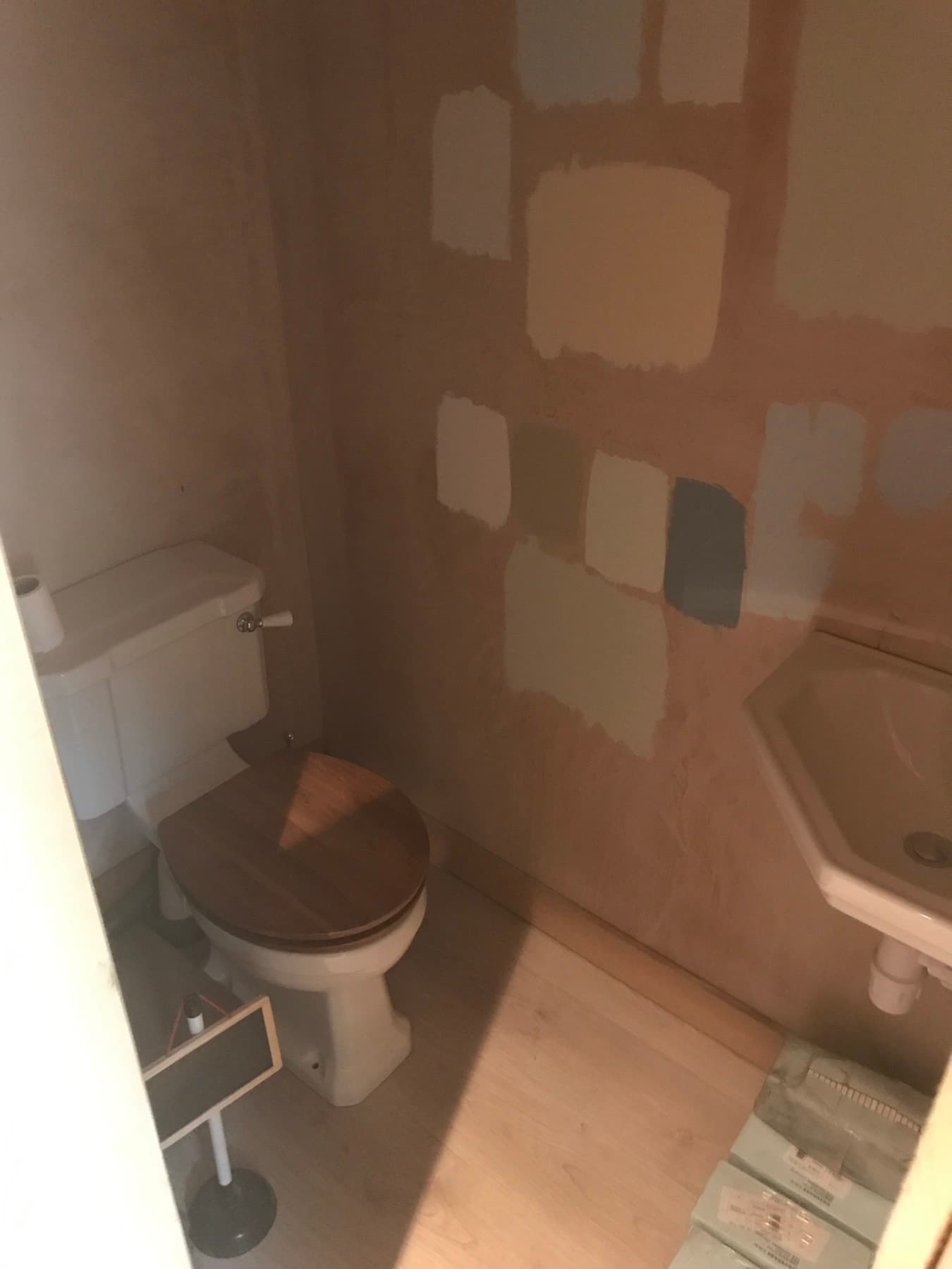 Quadrant shower enclosure with an exposed thermostatic bar valve and riser rail