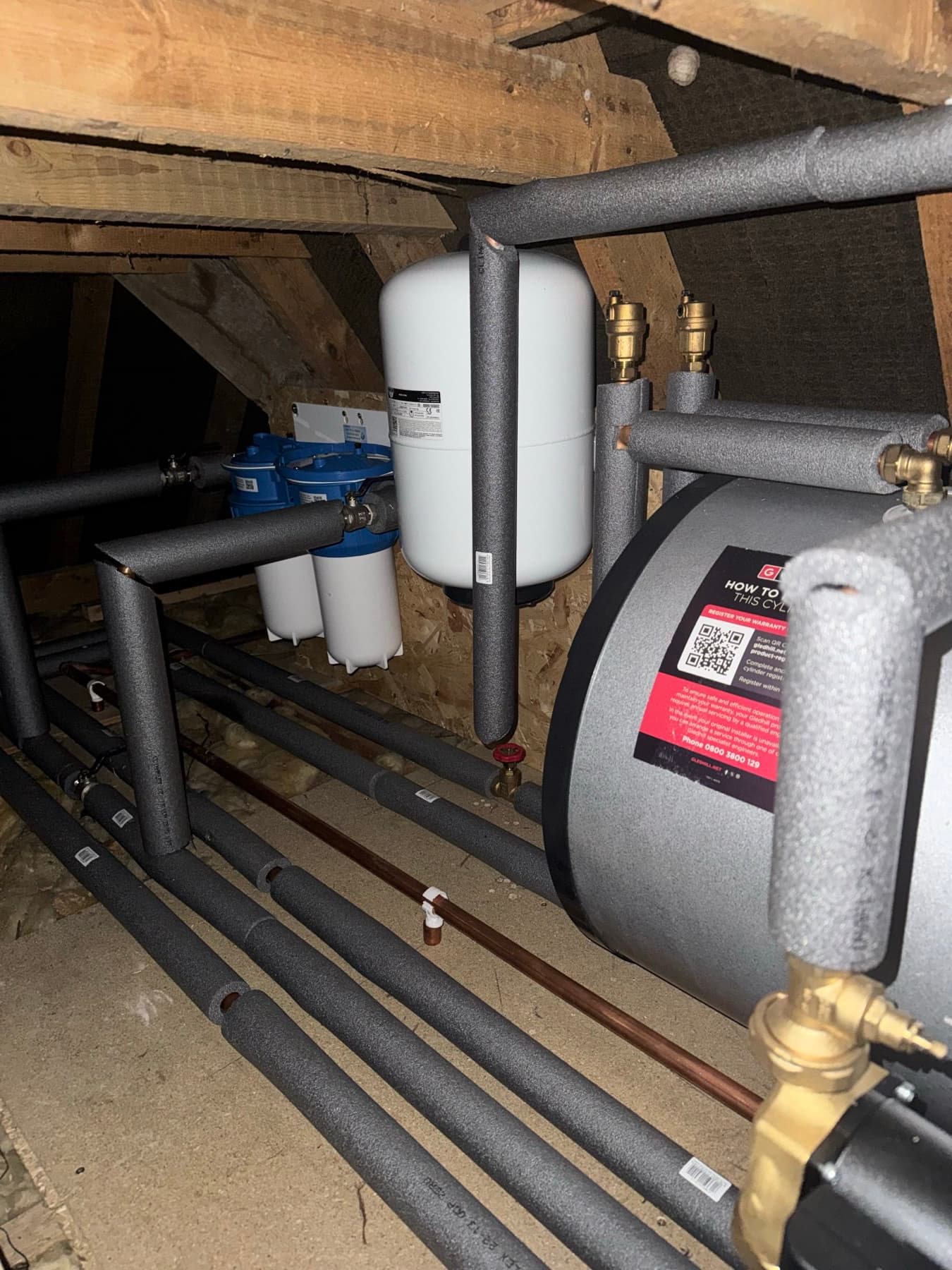 Loft pipework lagged against frost, with the pump and vessel insulated