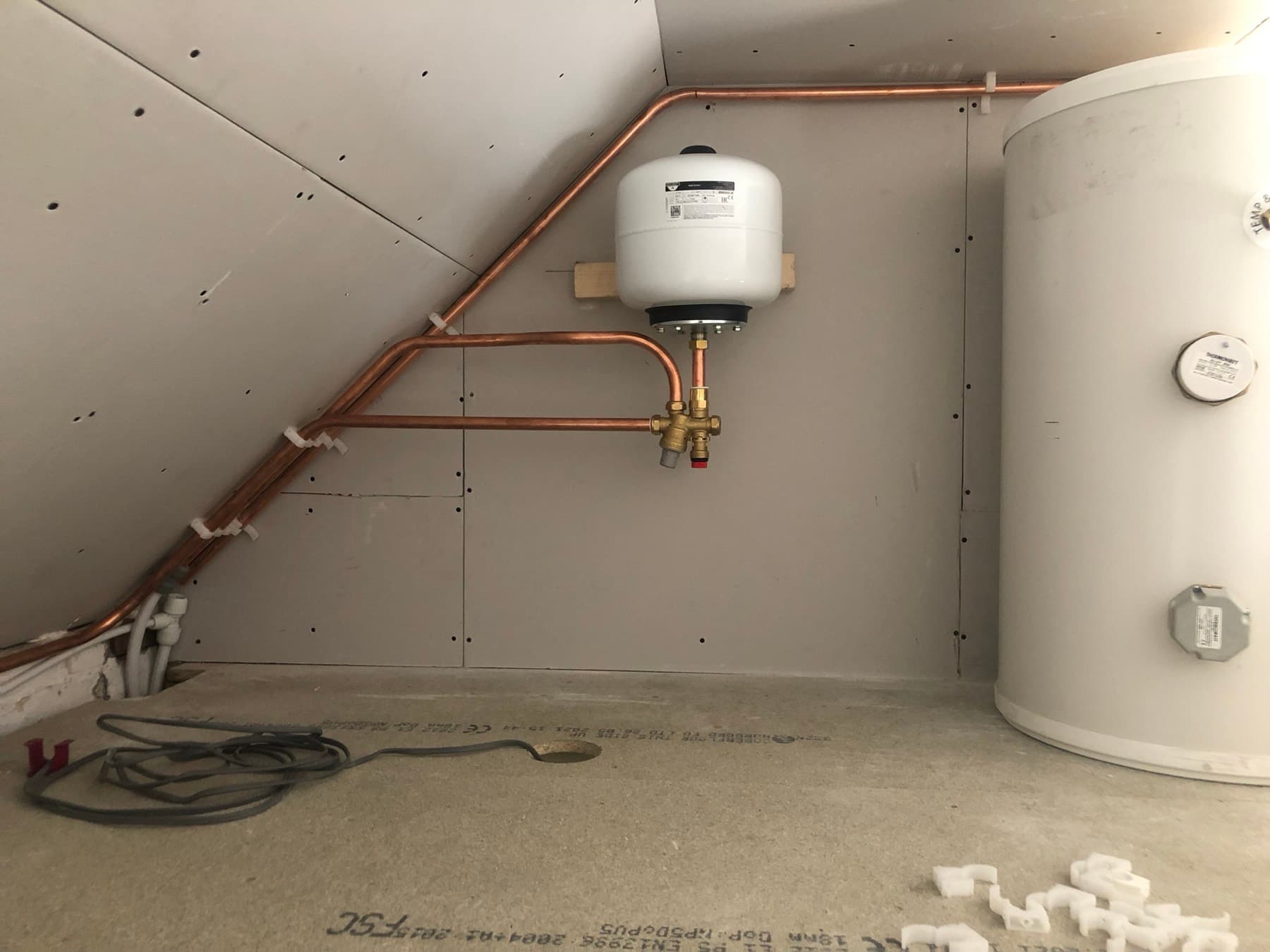 Unvented cylinder and expansion vessel in a loft conversion