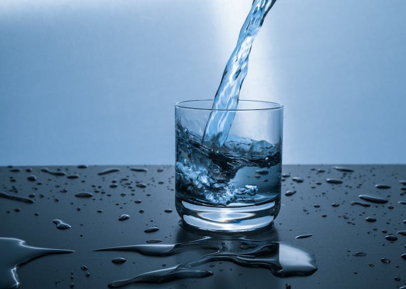 Glass of filtered water for quality testing